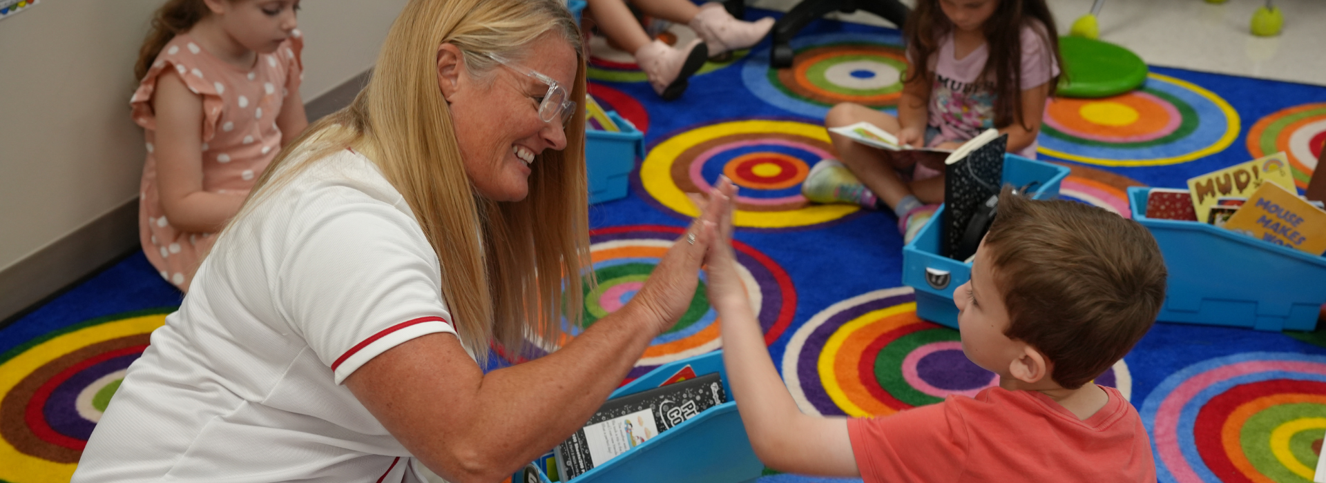 Mercer principal high fives a student